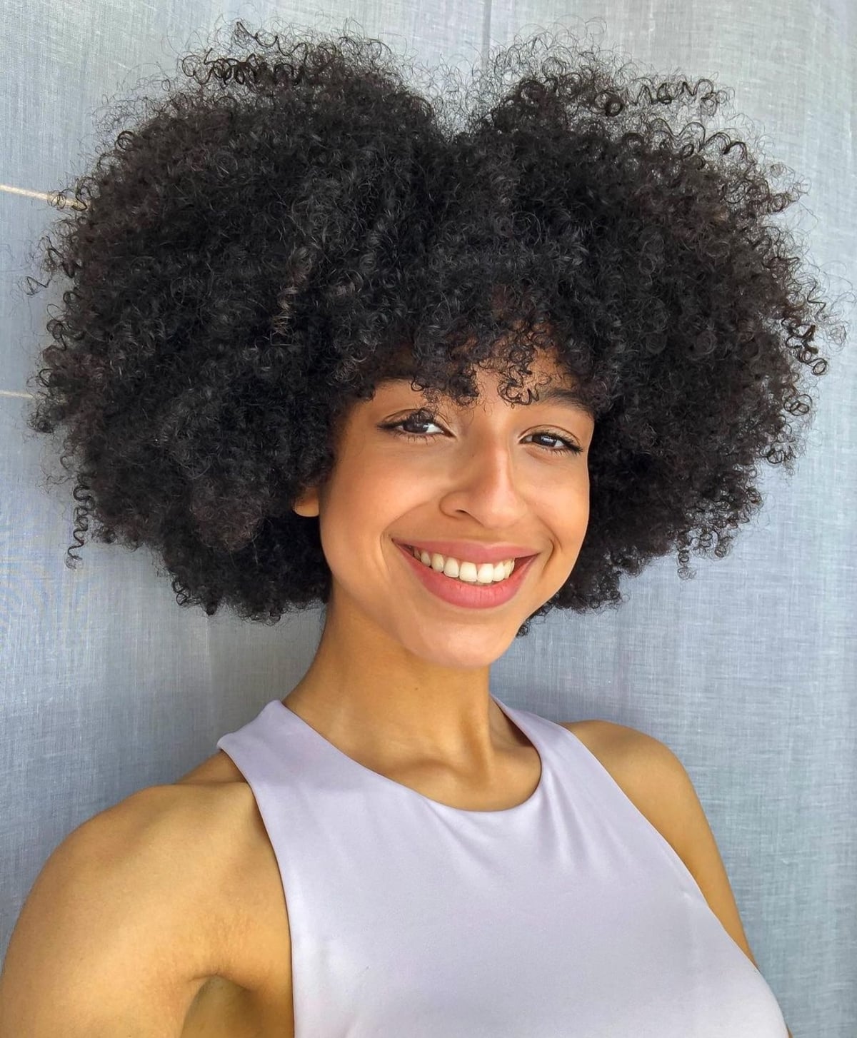 The 21 Cutest Examples of Naturally Curly Hair with Bangs