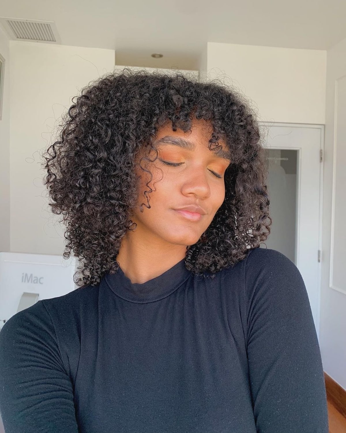 The 21 Cutest Examples of Naturally Curly Hair with Bangs