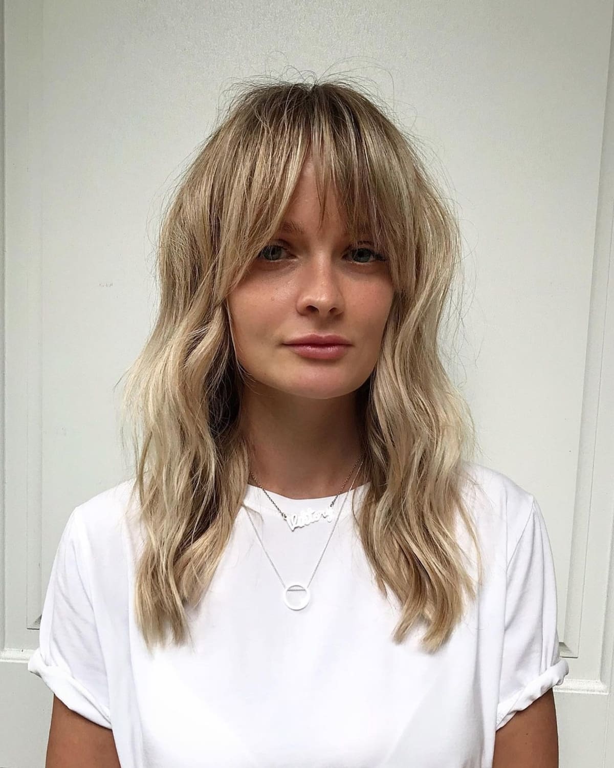 21 Trendiest Ways to Wear Long Curtain Bangs, According to Stylists