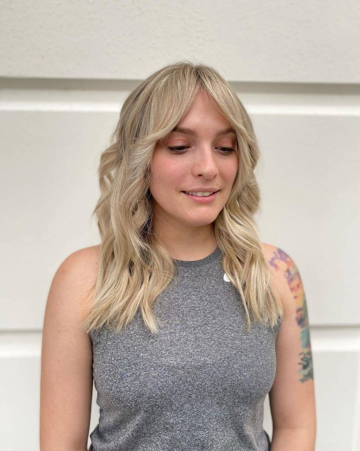 26 Ways to Pair Wavy Hair with Bangs for a Super-Flattering Look