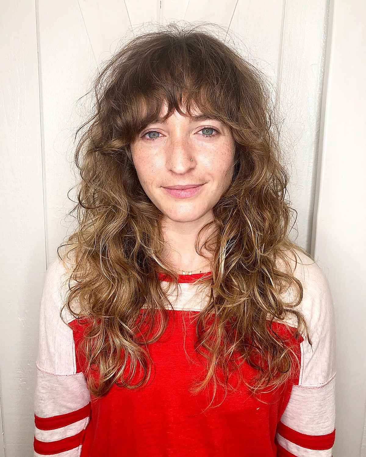 26 Ways to Pair Wavy Hair with Bangs for a Super-Flattering Look